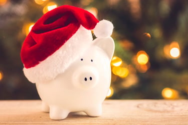 piggy bank wearing a Santa hat