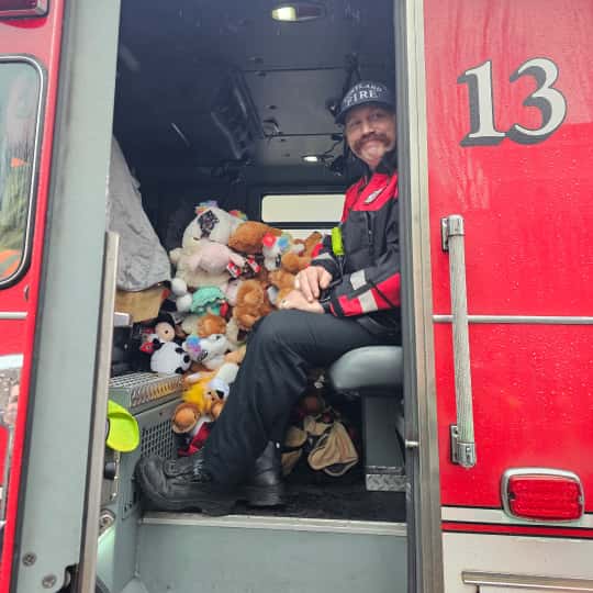 fire-fighter-with-stuffed-animals